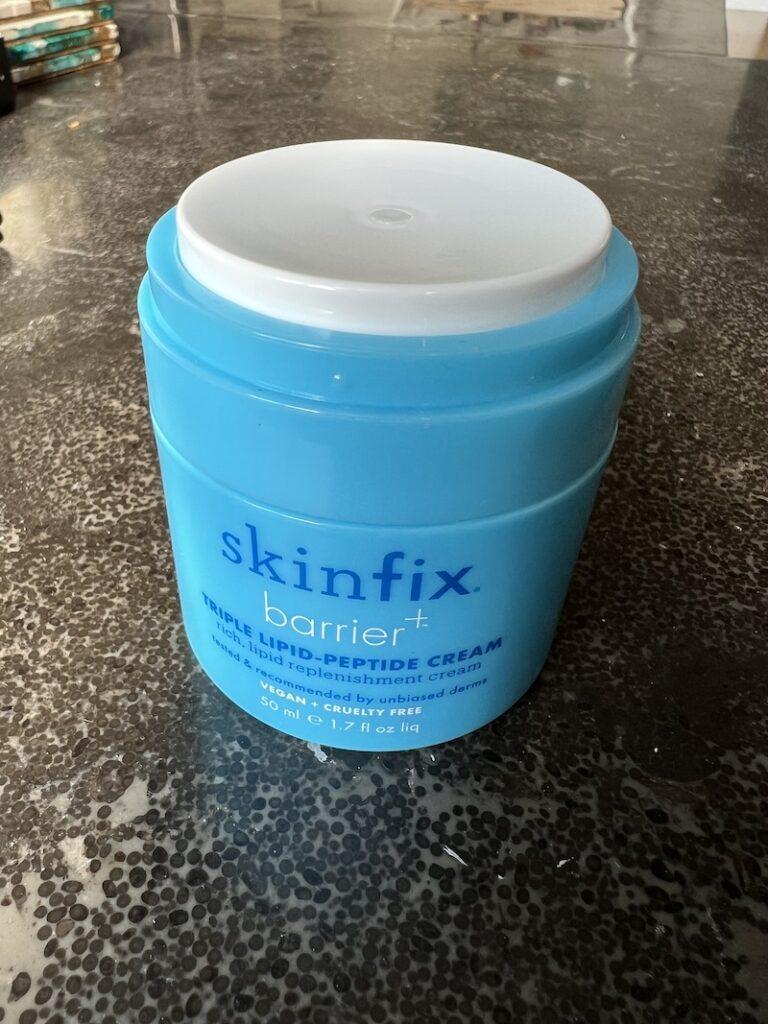 A photo of Skinfix Triple Lipid Peptide Cream on a black counter