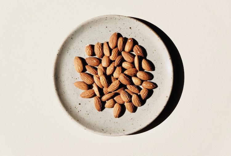 A shot of almonds on a plate