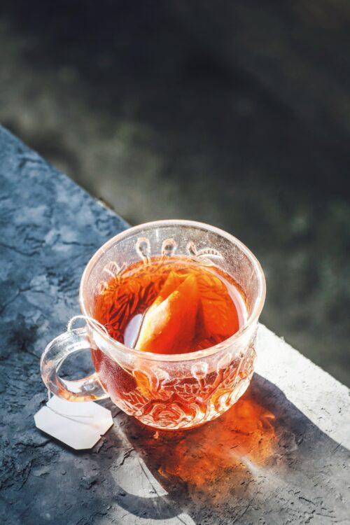 A glass mug of Rooibos tea, which is one of the best teas for acne