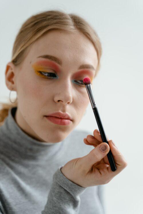 Woman applying makeup