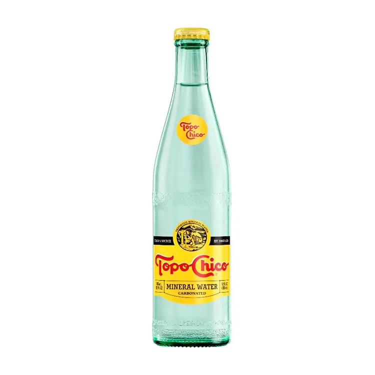 A closed bottle of Topo Chico seltzer water