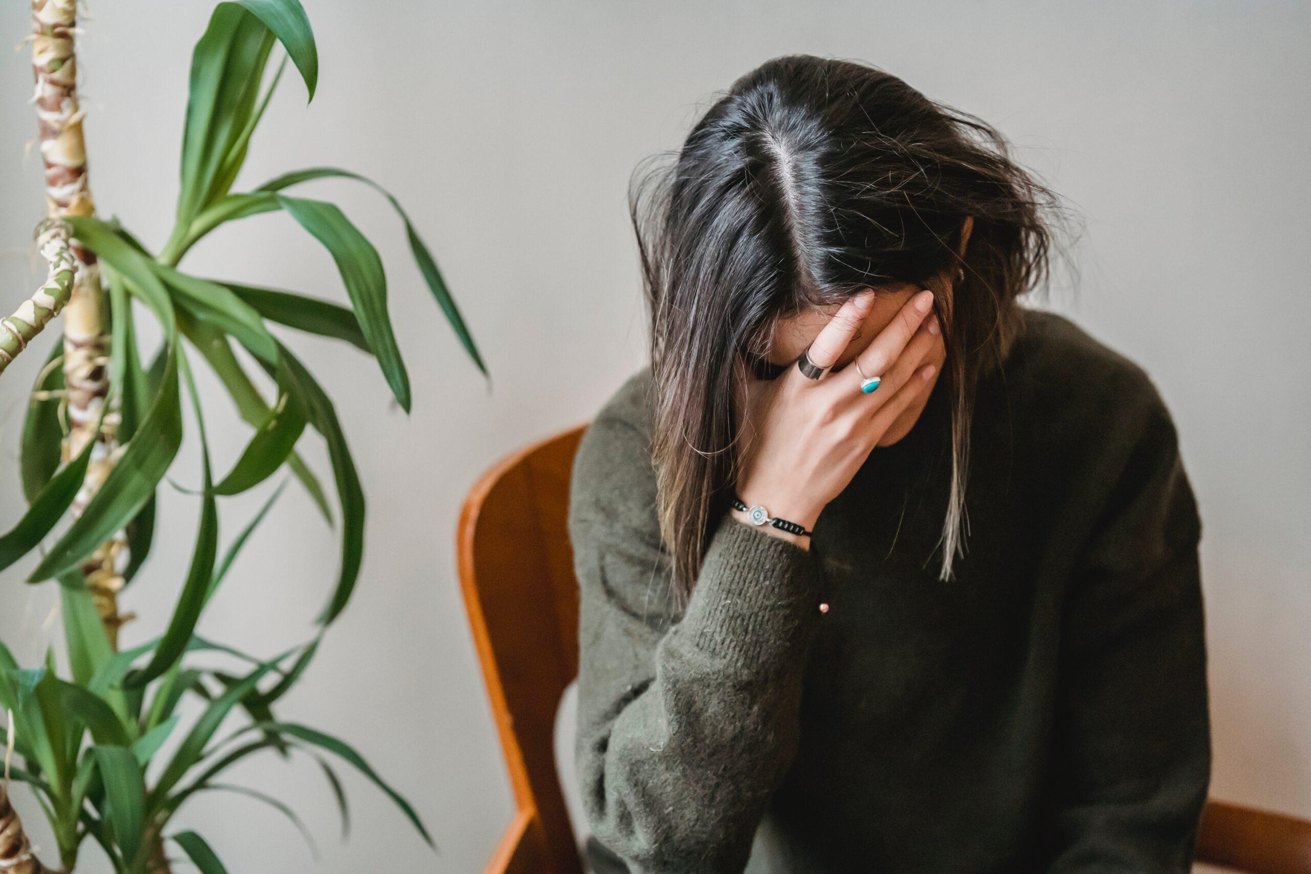 a woman experiencing hangxiety symptoms