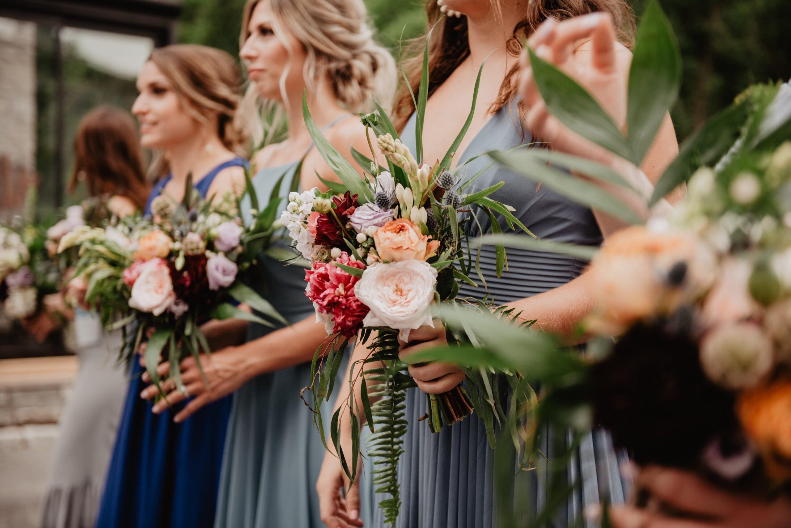 Women wearing four different bridesmaid dresses for fall