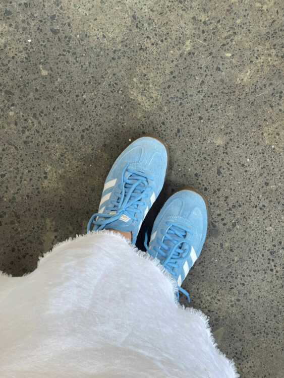 Blue Adidas with a white dress