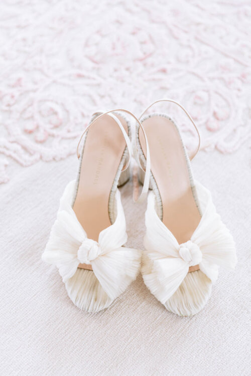 White shoes also pair well with a white dress