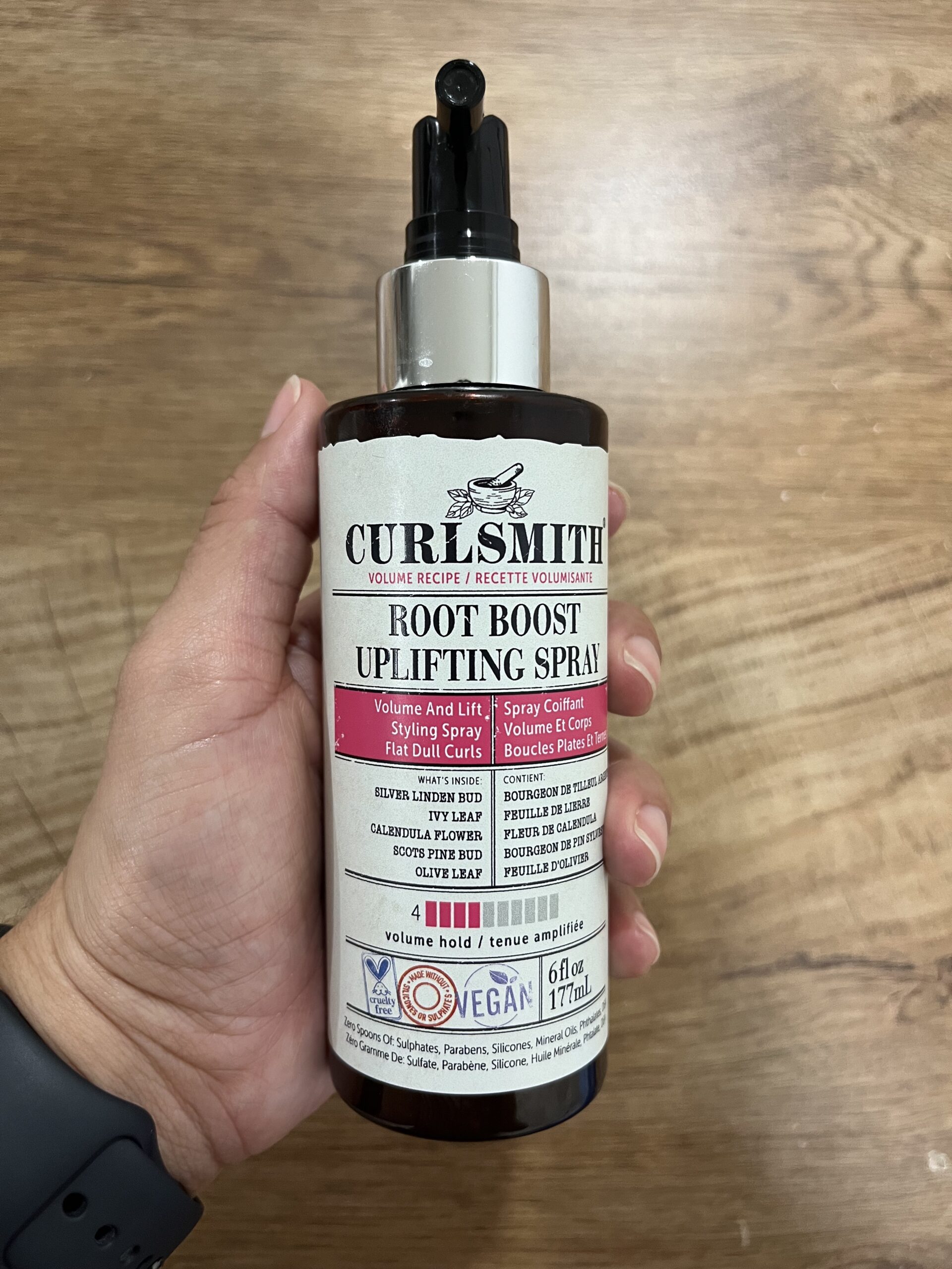 a brown spray bottle of root boost