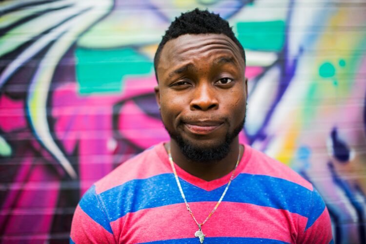 Person with a faux hawk haircut, which is one of the best male medium-length haircuts