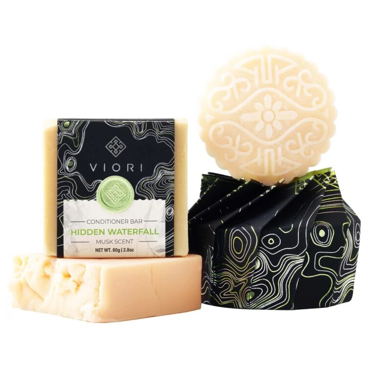 Product shot of cream-colored shampoo and conditioner bars from Viori